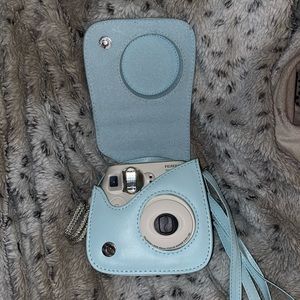 Fuji Film camera! White with super cute blue case.